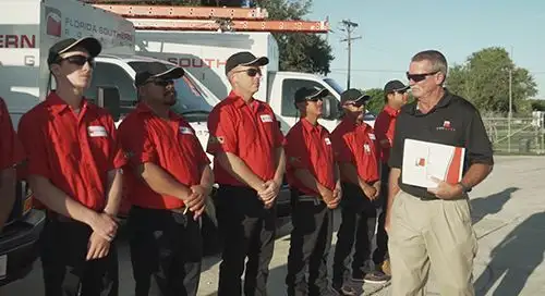 Click image of technicians receiving Master Elite Certification to go to Roof Inspections and Maintenance page